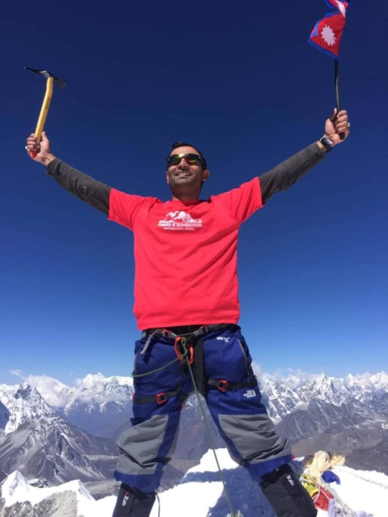 standing at Island peak summit 