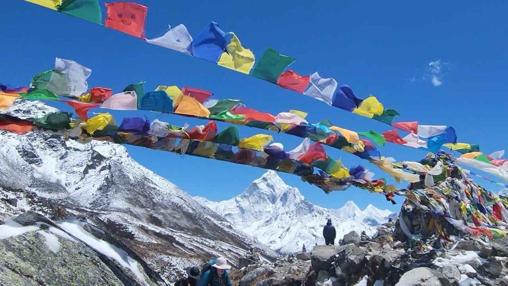 Prayer flags fluttering in the Himalayas along the Everest Base Camp Trek.