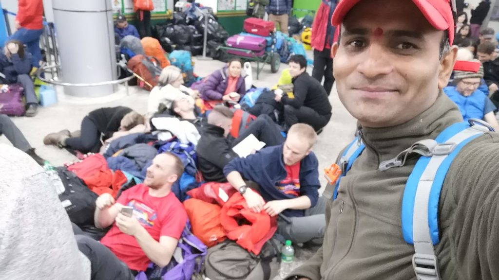 Trekkers sleeping on the floor at Kathmandu Airport after a Lukla flight delay